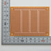 写真：小型ユニバーサル基板（紙フェノール片面／72×95×1.6t）（ICB-293U）：はんだ面