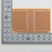 写真：小型ユニバーサル基板（紙フェノール片面／47×72×1.6t）（ICB-87）：はんだ面