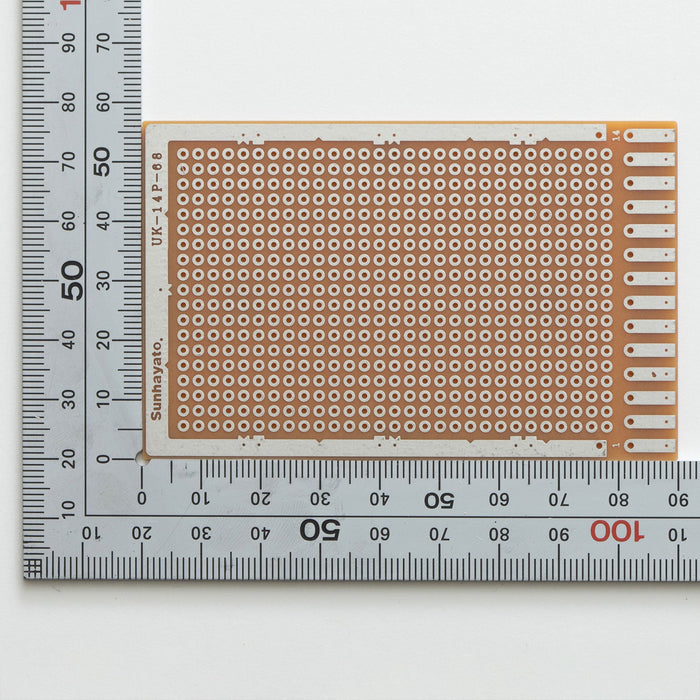 写真：端子付きユニバーサル基板（紙フェノール片面／57×90×1.6t）（UK-14P-68）：はんだ面